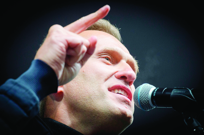(FILES) In this file photo taken on September 29, 2019 Russian opposition leader Alexei Navalny delivers a speech during a demonstration in Moscow. - Navalny's test results 'indicate poisoning' and long-term effects 'cannot be ruled out', Berlin hospital on August 24, 2020 said. (Photo by Yuri KADOBNOV / AFP)