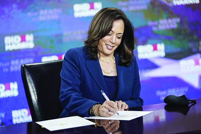 WILMINGTON: US Sen Kamala Harris signs required documents for receiving the Democratic nomination for Vice President on Friday. — AFP