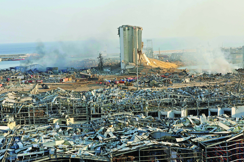 TOPSHOT - A destroyed silo is seen amid the rubble and debris following yesterday's blast at the port of Lebanon's capital Beirut, on August 5, 2020. - Rescuers worked through the night after two enormous explosions ripped through Beirut's port, killing at least 78 people and injuring thousands, as they wrecked buildings across the Lebanese capital. (Photo by Anwar AMRO / AFP)