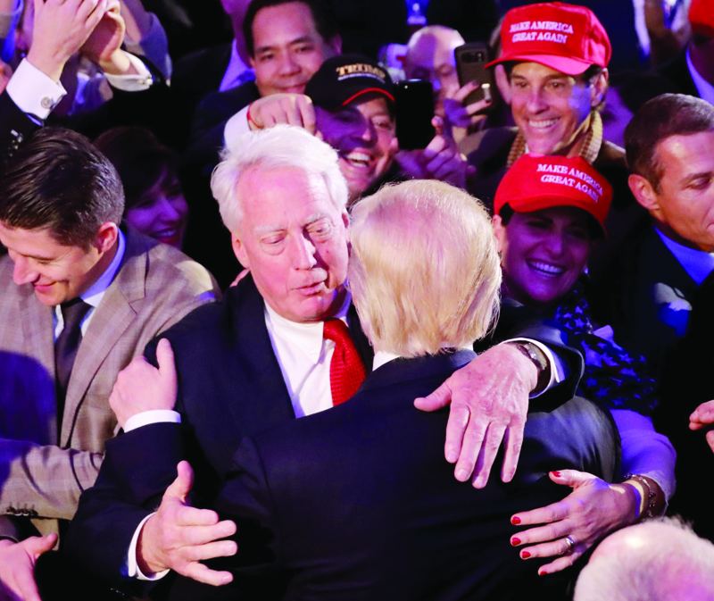 (FILES) In this file photo taken on November 09, 2016 Republican president-elect Donald Trump (front) hugs his brother Robert Trump after delivering his acceptance speech in New York City. - The WHite House announced Robert Trump, younger brother of US president Donald Trump, born in 1948, died August 15, 2020 at a New York hospital. (Photo by CHIP SOMODEVILLA / GETTY IMAGES NORTH AMERICA / AFP)