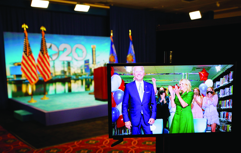 TOPSHOT - US Democratic presidential candidate and former Vice President Joe Biden (L) reacting next to wife Jill Biden after being formally nominated as the Democratic presidential candidate during the second day of the convention on a video feed at its hosting site in Milwaukee, Wisconsin, on August 18, 2020. (Photo by BRIAN SNYDER / POOL / AFP)