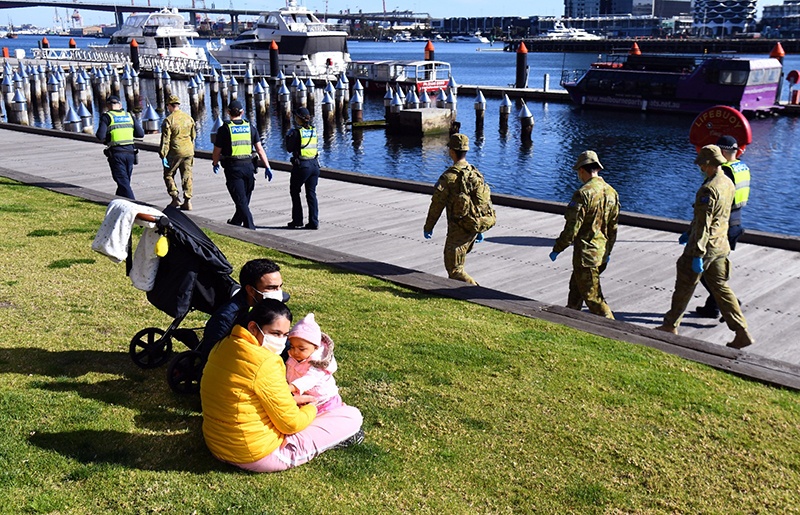 MELBOURNE: A group of police and soldiers patrol the Docklands area on August 2, 2020, after the announcement of new restrictions to curb the spread of the COVID-19 coronavirus. - AFP