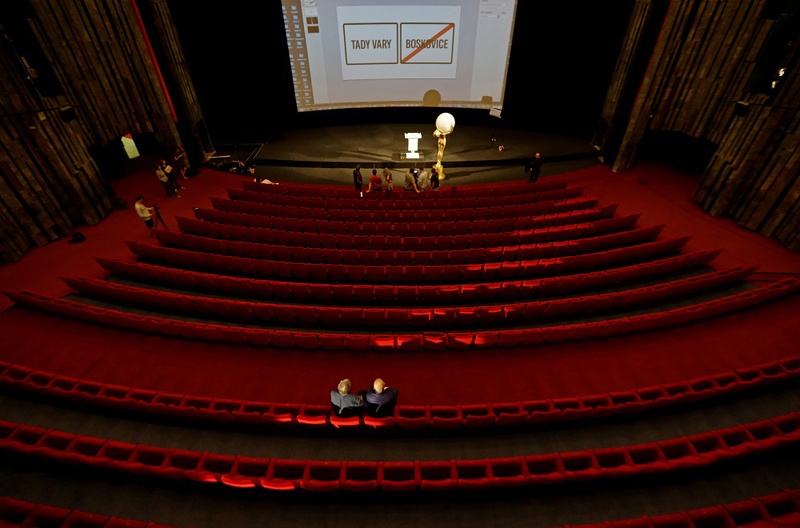 Staff members prepare a broadcast of an opening ceremony inside an empty cinema, as the Karlovy Vary International Film Festival launches a nationwide programme to bring its films to cinemas around the country after cancelling its main events following the coronavirus disease (COVID-19) outbreak in Karlovy Vary, Czech Republic, July 3, 2020.  REUTERS/David W Cerny
