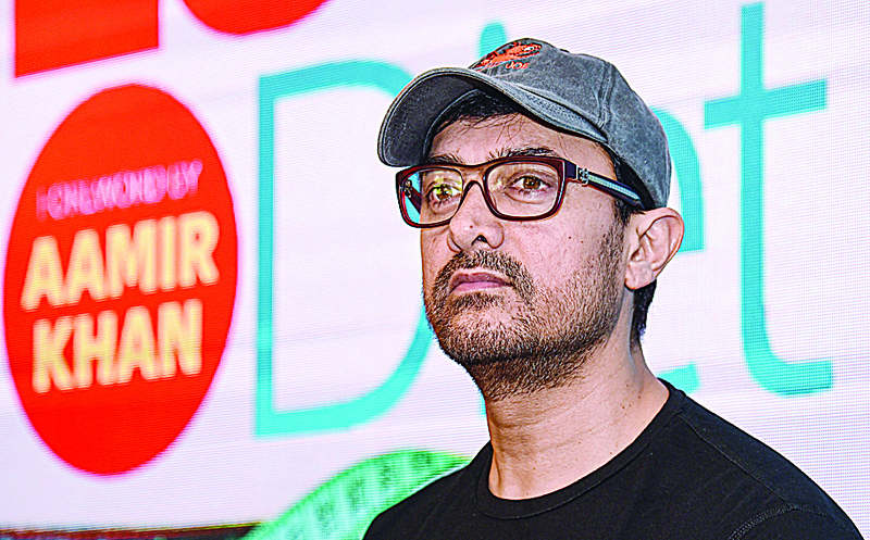 (FILES) In this file photo taken on March 27, 2019 Indian Bollywood actor Aamir Khan looks on during the launch of a book about weight loss in Mumbai. - Khan, a Muslim, has long been a hate figure for India's Hindu far-right but now they have a new line of attack: his massive popularity in China. Prime Minister Narendra Modi's government has fanned growing hostility to China following a deadly clash on their disputed Himalayan border on June 13. (Photo by Sujit Jaiswal / AFP)