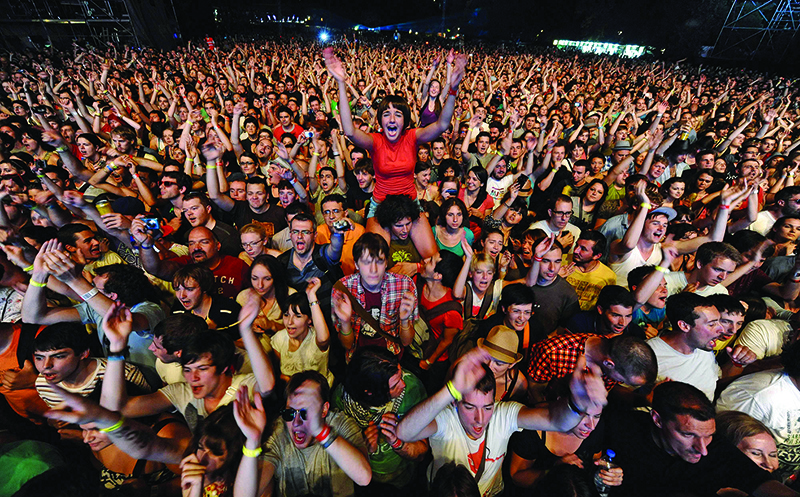In this file photo, festival goers cheer during a concert at the EXIT festival near Novi Sad. — AFP photos