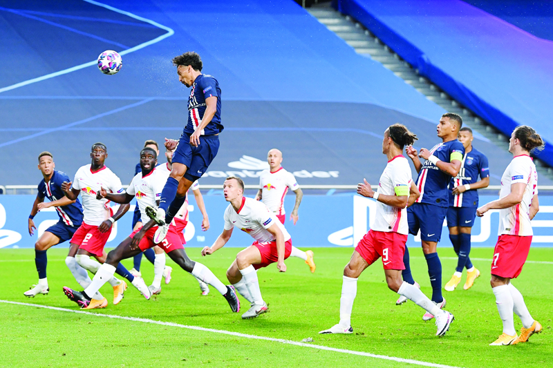 Paris Saint-Germain's Brazilian defender Marquinhos heads the ball and scores during the UEFA Champions League semi-final football match between Leipzig and Paris Saint-Germain at the Luz stadium in Lisbon on August 18, 2020. (Photo by David Ramos / POOL / AFP)