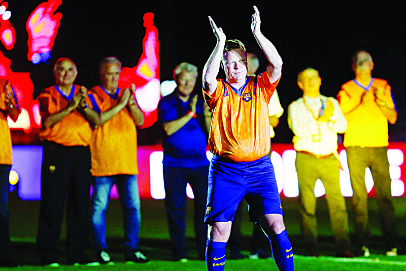 (FILES) In this file photo taken on June 10, 2017 former FC Barcelona's Dutch defender Ronald Koeman acknowledges the crowd during a tribute match against SL Benfica at the Camp Nou stadium in Barcelona. - Former Barcelona's Dutch player Ronald Koeman was appointed on August 18, 2020 as new coach of FC Barcelona, assuming the heavy task of rebuilding the team, devastated by its 8-2 rout against Bayern Munich in Champions League's quarter-finals. (Photo by PAU BARRENA / AFP)