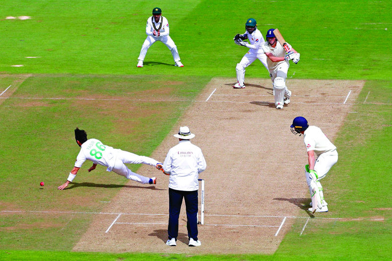 England's Zak Crawley plays a shot past Pakistan's Yasir Shah (L) on the second day of the third Test cricket match between England and Pakistan at the Ageas Bowl in Southampton, southern England on August 22, 2020. (Photo by Alastair Grant / POOL / AFP) / RESTRICTED TO EDITORIAL USE. NO ASSOCIATION WITH DIRECT COMPETITOR OF SPONSOR, PARTNER, OR SUPPLIER OF THE ECB