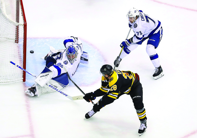 TORONTO, ONTARIO - AUGUST 29: Andrei Vasilevskiy #88 of the Tampa Bay Lightning stops a shot against Ondrej Kase #28 of the Boston Bruins during the third period in Game Four of the Eastern Conference Second Round during the 2020 NHL Stanley Cup Playoffs at Scotiabank Arena on August 29, 2020 in Toronto, Ontario.   Elsa/Getty Images/AFPn== FOR NEWSPAPERS, INTERNET, TELCOS &amp; TELEVISION USE ONLY ==
