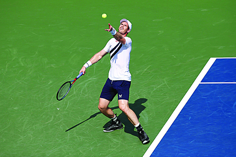 NEW YORK, NEW YORK - AUGUST 22: Andy Murray of Great Britain serves the ball against Frances Tiafoe of the United States during their Men's Singles First Round match against Frances Tiafoe of the United States on day three of the 2020 Western &amp; Southern Open at USTA Billie Jean King National Tennis Center on August 22, 2020 in the Queens borough of New York City.   Matthew Stockman/Getty Images/AFPn== FOR NEWSPAPERS, INTERNET, TELCOS &amp; TELEVISION USE ONLY ==