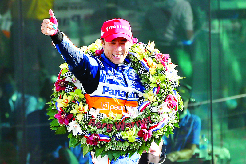 INDIANAPOLIS, INDIANA - AUGUST 23: Takuma Sato of Japan celebrates winning the 104th running of the Indianapolis 500 at Indianapolis Motor Speedway on August 23, 2020 in Indianapolis, Indiana. This year's race was run without fans in attendance due to the global Covid-19 pandemic.   Jonathan Ferrey/Getty Images/AFP
