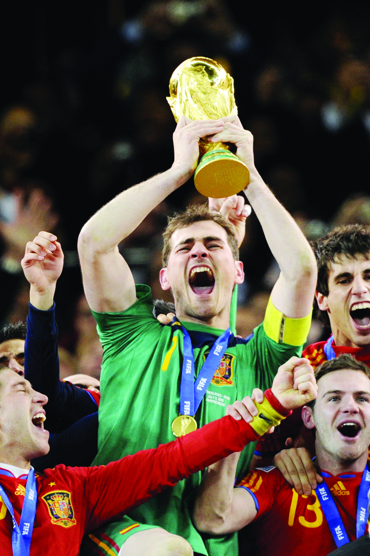 (FILES) In this file photo taken on July 11, 2010 Spain's goalkeeper Iker Casillas  celebrates with the trophy following the 2010 World Cup football final between the Netherlands and Spain on July 11, 2010 at Soccer City stadium in Soweto, suburban Johannesburg. - Spain's World Cup-winning goalkeeper Iker Casillas announced his retirement on August 4, 2020, after being sidelined for more than a year with a heart problem. Casillas, 39, also won the European Championship twice with his country in a trophy-laden career which included more than 700 games for Real Madrid. (Photo by Javier SORIANO / AFP)