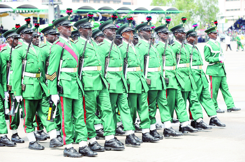 (FILES) In this file photo taken on October 01, 2010 Nigerian soldiers march in Eagle Square during the celebrations to mark Nigeria's 50th independence anniversary in Abuja. - On October 1, 2020, Nigeria celebrates its 60th independence from Britain. (Photo by Pius Utomi EKPEI / AFP)