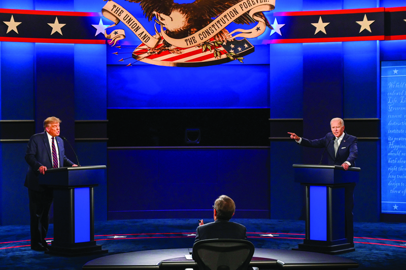 US President Donald Trump (L) and Democratic Presidential candidate and former US Vice President Joe Biden exchange arguments during the first presidential debate at Case Western Reserve University and Cleveland Clinic in Cleveland, Ohio, on September 29, 2020. (Photo by Jim WATSON / AFP)
