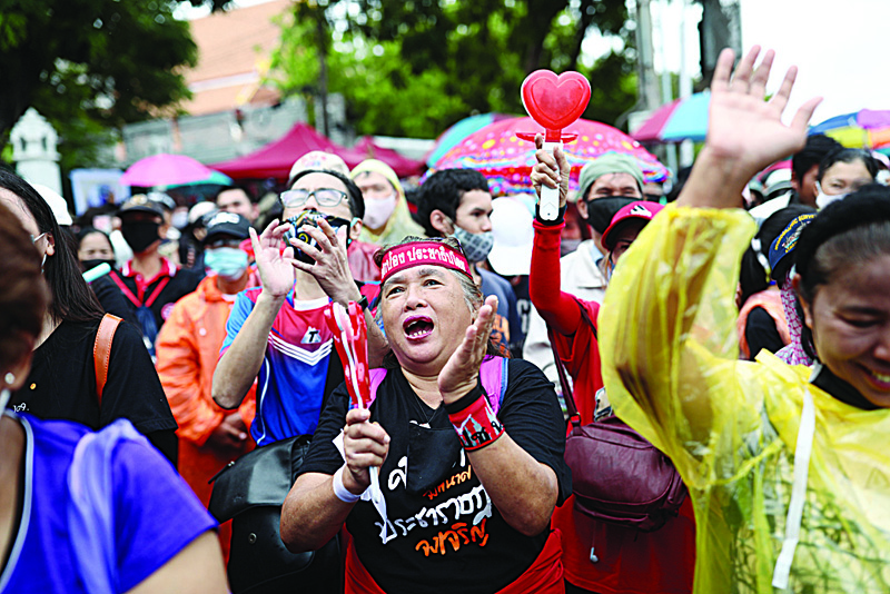 Pro-democracy protesters shout slogans during an anti-government rally in Bangkok on September 19, 2020. - A youth-led pro-democracy movement made a stand in Bangkok on September 19, with protesters calling for Prime Minister Prayut Chan-O-Cha to step down and demanding reforms to the monarchy. (Photo by Jack TAYLOR / AFP)