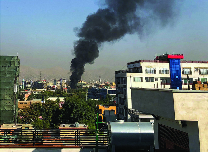 KABUL: A smoke plume rises following an explosion targeting the convoy of Afghanistan's vice president Amrullah Saleh in Kabul yesterday. - AFP