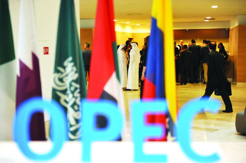 (FILES) In this file photo taken on September 28, 2016, participants gather in the lobby ahead of an informal meeting between members of the Organization of Petroleum Exporting Countries, OPEC, in the Algerian capital Algiers. - Global stocks fell September 17, 2020 as markets digested cautious outlooks from central banks, while oil prices rallied again as Saudi Arabia's top oil official called for compliance from other exporters on an OPEC+ production agreement. Though authorities in numerous countries have been recently upgrading their economic forecasts, central banks are warning that a quick, full recovery is far from assured. (Photo by Ryad KRAMDI / AFP)