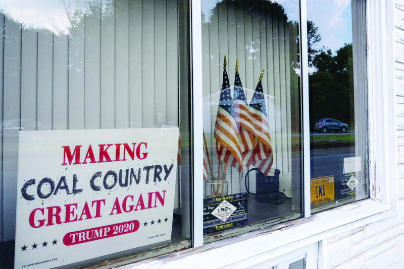 A Trump2020 sign is seen in the window of the Independent Miners &amp; Associates office, Tremont, Pennsylvania, U.S., July 9, 2020. REUTERS/Dane Rhys