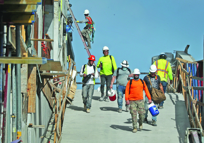 MIAMI, Florida: Construction workers are seen on a job site on Friday in Miami, Florida. The Bureau of Labor Statistics released a report Friday that shows the unemployment rate fell to 8.4 percent last month, down from a COVID-19 pandemic peak of 14.7 percent in April. — AFP