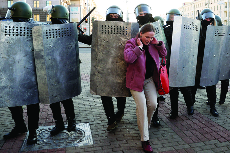 A woman hustles with law enforcement officers as they block the road during a demonstration called by opposition movement for an end to the regime of authoritarian leader in Minsk on September 20, 2020. - Belarus President Alexander Lukashenko, who has ruled the ex-Soviet state for 26 years, claimed to have defeated opposition leader Svetlana Tikhanovskaya with 80 percent of the vote in the August 9, elections. (Photo by - / AFP) / The erroneous mention[s] appearing in the metadata of this photo by STRINGER has been modified in AFP systems in the following manner: [source : AFP] instead of [source : TUT.BY]. Please immediately remove the erroneous mention[s] from all your online services and delete it (them) from your servers. If you have been authorized by AFP to distribute it (them) to third parties, please ensure that the same actions are carried out by them. Failure to promptly comply with these instructions will entail liability on your part for any continued or post notification usage. Therefore we thank you very much for all your attention and prompt action. We are sorry for the inconvenience this notification may cause and remain at your disposal for any further information you may require.î