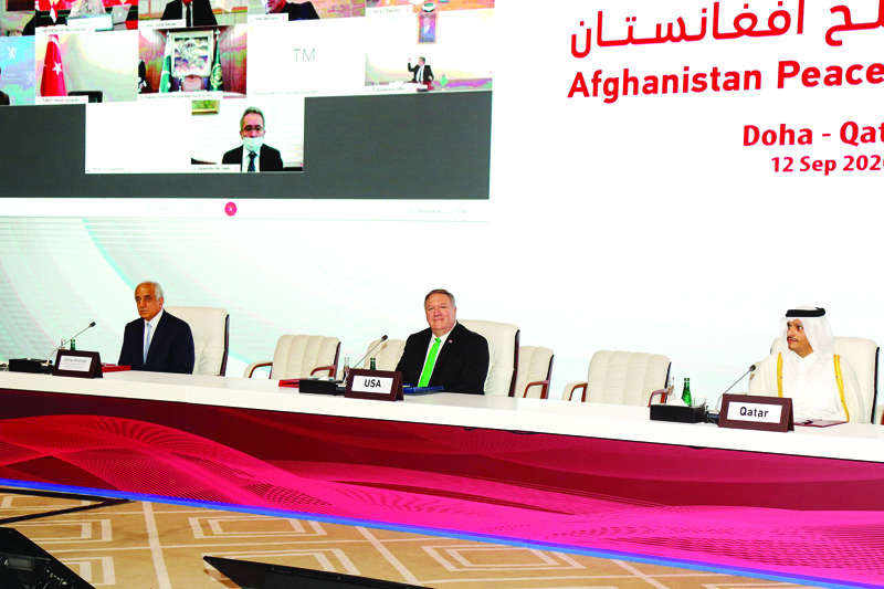 (L to R) US Special Representative for Afghanistan Reconciliation Zalmay Khalilzad, US Secretary of State Mike Pompeo, and Qatar's Minister of Foreign Affairs Sheikh Mohamad Bin Abdel Rahman Al-Thani attend the opening session of the peace talks between the Afghan government and the Taliban in the Qatari capital Doha on September 12, 2020. (Photo by KARIM JAAFAR / AFP)