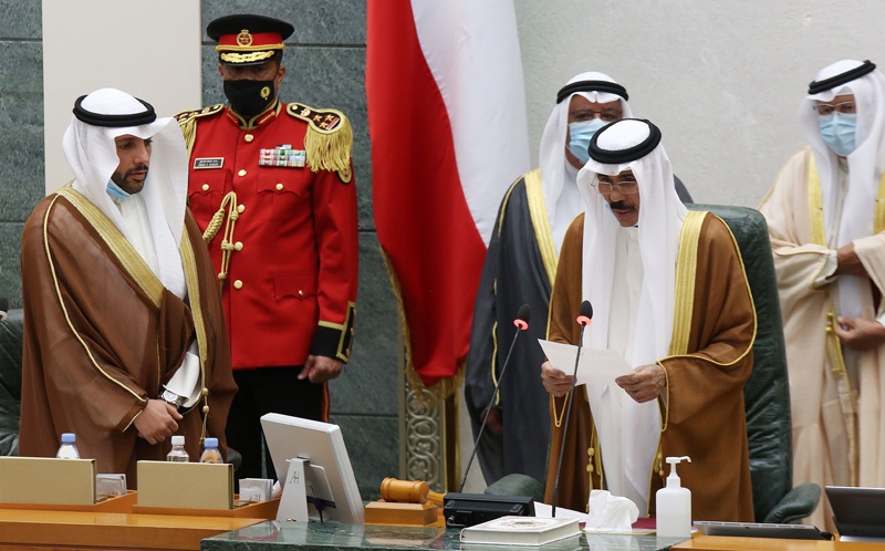 Sheikh Nawaf al-Ahmad Al-Sabah (2-R) reads a statement asfter being sworn in as Kuwait's new Emir at the National Assembly in Kuwait City, as Parilament Speaker Marzouq al-Ghanem (L) looks on, on September 30, 2020. - Kuwait on Wednesday swore in its new emir, Sheikh Nawaf al-Ahmad Al-Sabah, after the death of his half-brother, Sheikh Sabah, who died in the US at the age of 91. (Photo by Yasser Al-Zayyat / AFP)