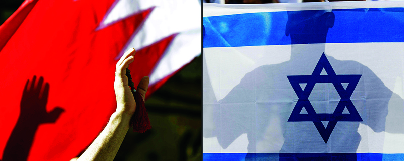 (COMBO) This combination of pictures created on September 11, 2020 shows a Bahraini man waving a national flag (L) in the capital Manama on March 22, 2011, and an Israeli man holding his country's national flag on January 24, 2017. - US President and Israel premier announced on September 11, 2020, a normalisation deal between Bahrain and Israel. (Photos by JOSEPH EID and JACK GUEZ / AFP)