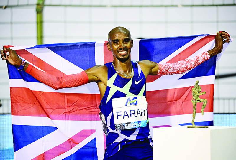 BRUSSELS: Britain’s Mo Farah celebrates after victory and a world record in the men’s one hour event at The Diamond League AG Memorial Van Damme athletics meeting at The King Baudouin Stadium in Brussels. — AFP