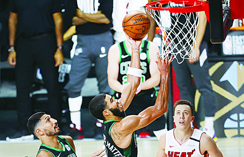 LAKE BUENA VISTA, FLORIDA - SEPTEMBER 25: Jayson Tatum #0 of the Boston Celtics drives to the basket during the third quarter against the Miami Heat in Game Five of the Eastern Conference Finals during the 2020 NBA Playoffs at AdventHealth Arena at the ESPN Wide World Of Sports Complex on September 25, 2020 in Lake Buena Vista, Florida. NOTE TO USER: User expressly acknowledges and agrees that, by downloading and or using this photograph, User is consenting to the terms and conditions of the Getty Images License Agreement.   Mike Ehrmann/Getty Images/AFPn== FOR NEWSPAPERS, INTERNET, TELCOS &amp; TELEVISION USE ONLY ==