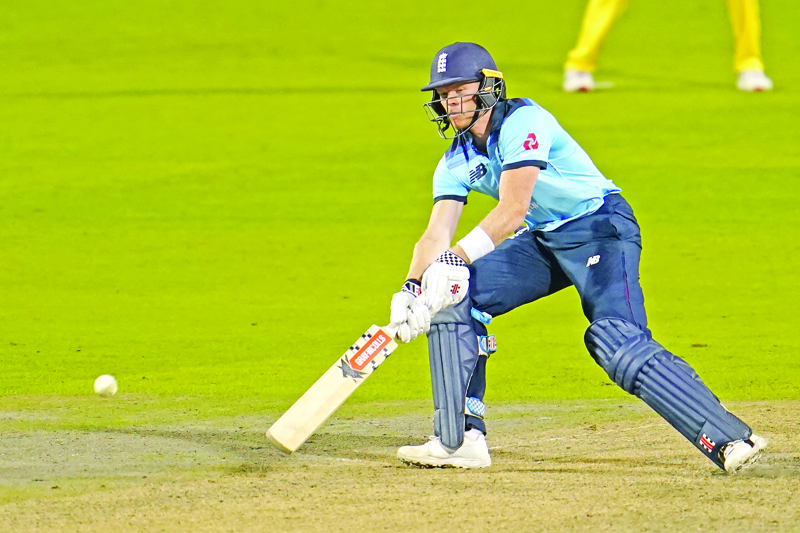 England's Sam Billings plays a ramp shot during the one-day international (ODI) cricket match between England and Australia at Old Trafford in Manchester on September 11, 2020. (Photo by Jon Super / POOL / AFP) / RESTRICTED TO EDITORIAL USE. NO ASSOCIATION WITH DIRECT COMPETITOR OF SPONSOR, PARTNER, OR SUPPLIER OF THE ECB