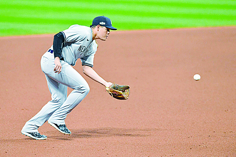 CLEVELAND, OHIO - SEPTEMBER 29: Third baseman Gio Urshela #29 of the New York Yankees throws out Franmil Reyes #32 of the Cleveland Indians during during the fourth inning Game One of the American League Wild Card Series at Progressive Field on September 29, 2020 in Cleveland, Ohio.   Jason Miller/Getty Images/AFPn== FOR NEWSPAPERS, INTERNET, TELCOS &amp; TELEVISION USE ONLY ==