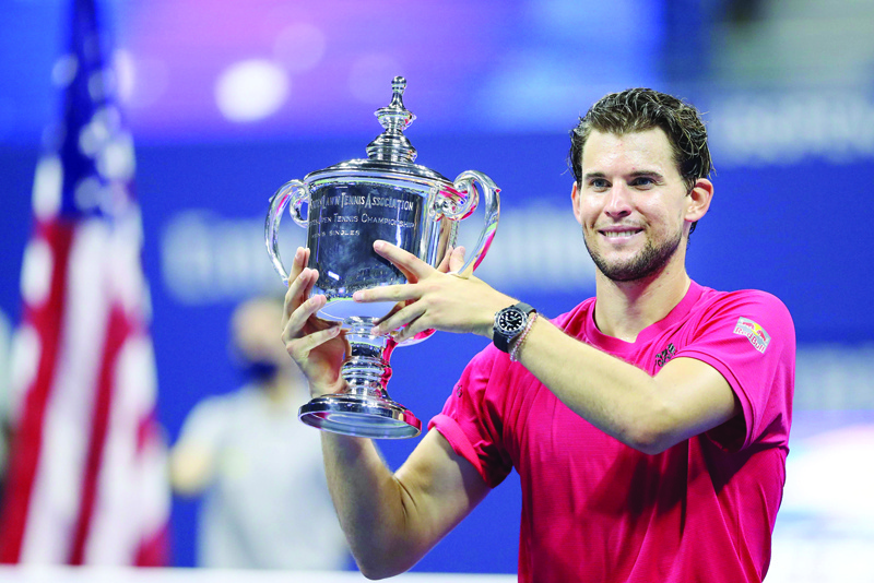 NEW YORK, NEW YORK - SEPTEMBER 13: Dominic Thiem of Austria celebrates with championship trophy after winning in a tie-breaker during his Men's Singles final match against Alexander Zverev of Germany on Day Fourteen of the 2020 US Open at the USTA Billie Jean King National Tennis Center on September 13, 2020 in the Queens borough of New York City.   Matthew Stockman/Getty Images/AFPn== FOR NEWSPAPERS, INTERNET, TELCOS &amp; TELEVISION USE ONLY ==