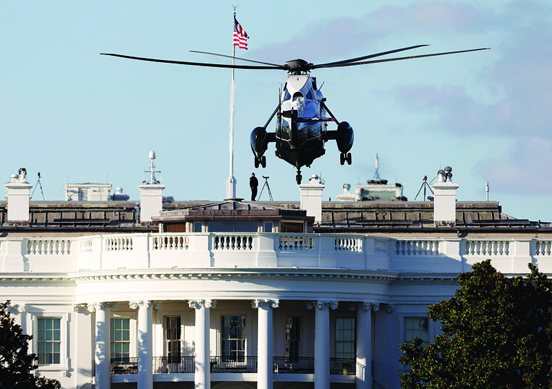 TOPSHOT - WASHINGTON, DC - OCTOBER 02: Marine One, the presidential helicopter, arrives at the White House to carry U.S. President Donald Trump to Walter Reed National Military Medical Center October 2, 2020 in Washington, DC. Trump announced earlier today via Twitter that he and U.S. first lady Melania Trump have tested positive for coronavirus.   Win McNamee/Getty Images/AFP (Photo by WIN MCNAMEE / GETTY IMAGES NORTH AMERICA / AFP)