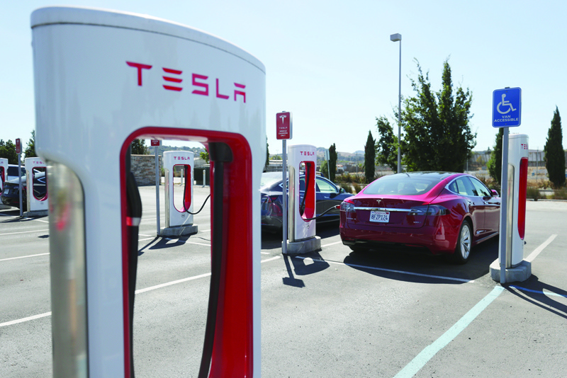 PETALUMA, CALIFORNIA - SEPTEMBER 23: A view of Tesla Superchargers on September 23, 2020 in Petaluma, California. California Gov. Gavin Newsom signed an executive order directing the California Air Resources Board to establish regulations that would require all new cars and passenger trucks sold in the state to be zero-emission vehicles by 2035. Sales of internal combustion engines would be banned in the state after 2035.   Justin Sullivan/Getty Images/AFP