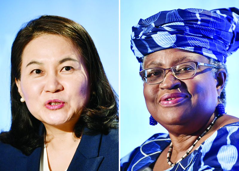 (COMBO) This combination of file pictures created on October 7, 2020, shows South Korean Trade Minister Yoo Myung-hee (L) in Geneva on July 16, 2020; and Nigerian former Foreign and Finance Minister Ngozi Okonjo-Iweala (R) in Geneva, July 15, 2020, as they give press conferences as part of their application process to head the WTO as Director General. - Two women, Yoo Myung-hee of South Korean and Ngozi Okonjo-Iweala of Nigeria, remain in the running to lead the World Trade Organization, sources familiar with the decision said on October 7, 2020, in what will be a first for the trade body. The official announcement of the two candidates left standing is expected on October 8, 2020. (Photo by Fabrice COFFRINI / AFP)