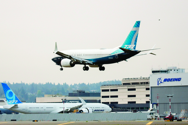 (FILES) In this file photo taken on September 30, 2020 a Boeing 737 MAX airliner piloted by Federal Aviation Administration (FAA) Administrator Steve Dickson lands following an evaluation flight at Boeing Field the in Seattle, Washington. - Boeing shares climbed on October 16, 2020 following a report that the European air safety regulator is ready  to allow the 737 MAX jet to return to the skies after its worldwide grounding. (Photo by Jason Redmond / AFP)