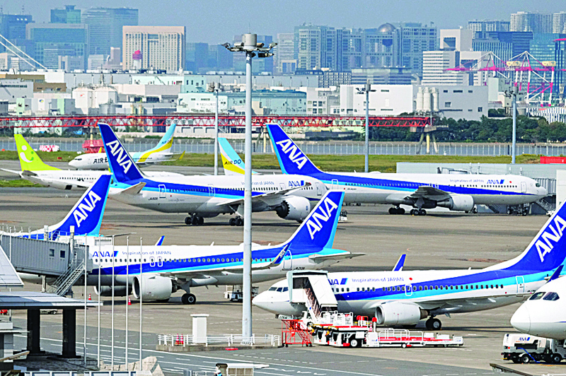 Passenger jets from Japanese carrier All Nippon Airways (ANA) are seen on the tarmac at Tokyo's Haneda airport on October 27, 2020. (Photo by Kazuhiro NOGI / AFP)