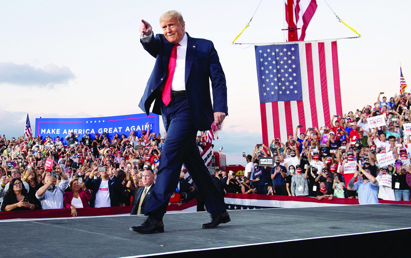 TOPSHOT - US President Donald Trump holds a Make America Great Again rally as he campaigns at Orlando Sanford International Airport in Sanford, Florida, October 12, 2020. (Photo by SAUL LOEB / AFP)