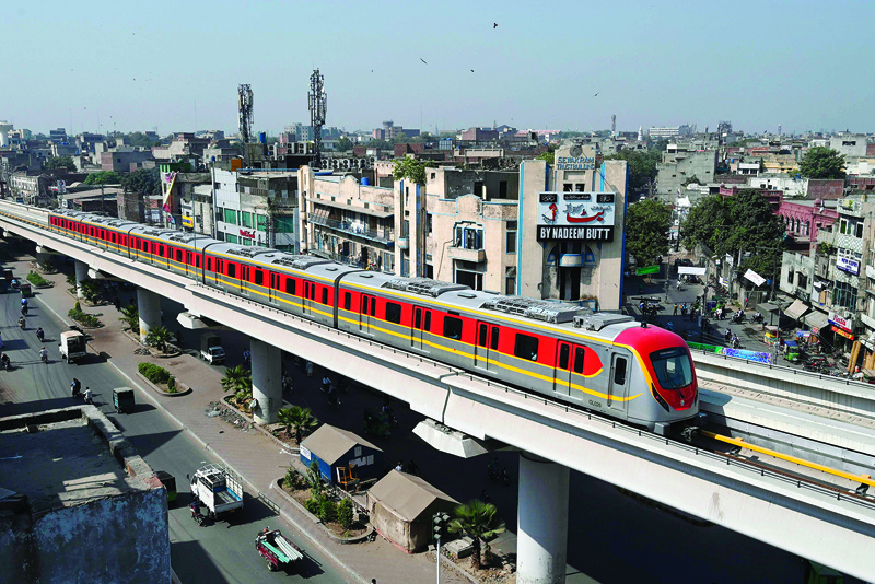 A newly built Orange Line Metro Train (OLMT), a metro project planned under the China-Pakistan Economic Corridor (CPEC), drives through on a track after an official opening in the eastern city of Lahore on October 26, 2020. (Photo by Arif ALI / AFP)