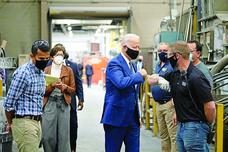 MANITOWOC, Wisconsin: In this photo taken on Sept 21, 2020, Democratic Presidential Candidate Joe Biden visits an aluminum manufacturing facility. — AFP