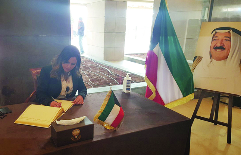 Lebanese information minister Manal Abdulsamad signs the book of condolence.