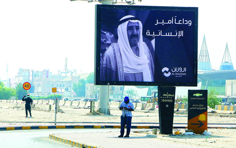 Emir of Kuwait Shiekh Sabah al-Ahmad al-Jaber al-Sabah photos, displayed at a billbored in the streets of Kuwait to convey their condolences on his death  in Kuwait City, on October 1, 2020.