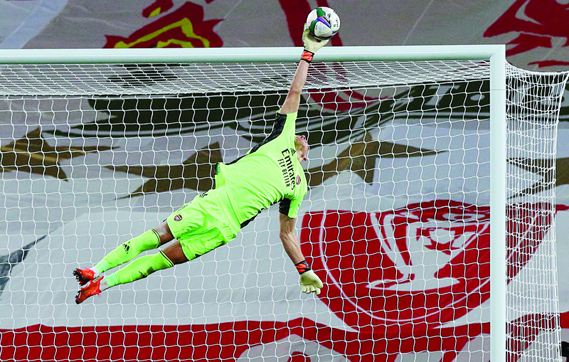 LIVERPOOL: Arsenal’s German goalkeeper Bernd Leno saves a shot from Liverpool’s Portuguese striker Diogo Jota during the English League Cup fourth round football match between Liverpool and Arsenal on October 1, 2020.  — AFP