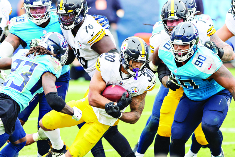 NASHVILLE, TN - OCTOBER 25: James Conner #30 of the Pittsburgh Steelers runs the ball in the second half of a game against the Tennessee Titans at Nissan Stadium on October 25, 2020 in Nashville, Tennessee. The Steelers defeated the Titans 27-24.   Wesley Hitt/Getty Images/AFP