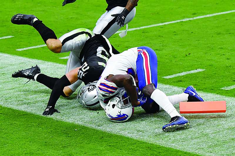 LAS VEGAS, NEVADA - OCTOBER 04: John Brown #15 of the Buffalo Bills rolls out of bounds after catching a 14-yard pass at the 1-yard line against Erik Harris #25 of the Las Vegas Raiders in the second half of the NFL game at Allegiant Stadium on October 4, 2020 in Las Vegas, Nevada. Buffalo challenged the call on the field of no touchdown but the play was upheld. The Bills defeated the Raiders 30-23.   Ethan Miller/Getty Images/AFP