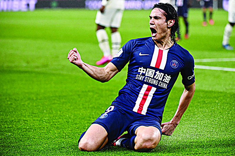 (FILES) In this file photo taken on February 23, 2020 Paris Saint-Germain's Uruguayan forward Edinson Cavani celebrates after scoring a goal  during the French L1 football match between Paris Saint-Germain (PSG) and Girondins de Bordeaux at the Parc des Princes stadium in Paris. - Manchester United were also on Monday night, a few hours before the transfer market closed, yet to secure the signing of Uruguayan international center-forward Edinson Cavani who left his former club, the Paris SG, this summer. (Photo by FRANCK FIFE / AFP)