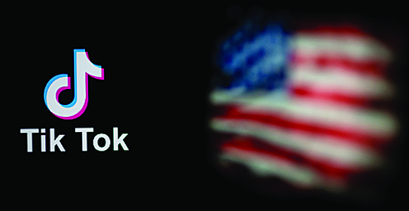 (FILES) This file photo illustration taken on September 14, 2020 shows the logo of the social network application TikTok (L) and a US flag (R) shown on the screens of two laptops in Beijing. - US President Donald Trump's administration has insisted on the need to ban TikTok due to national security concerns in a new court filing ahead of a plan to make the video app unavailable on November 12. (Photo by NICOLAS ASFOURI / AFP)
