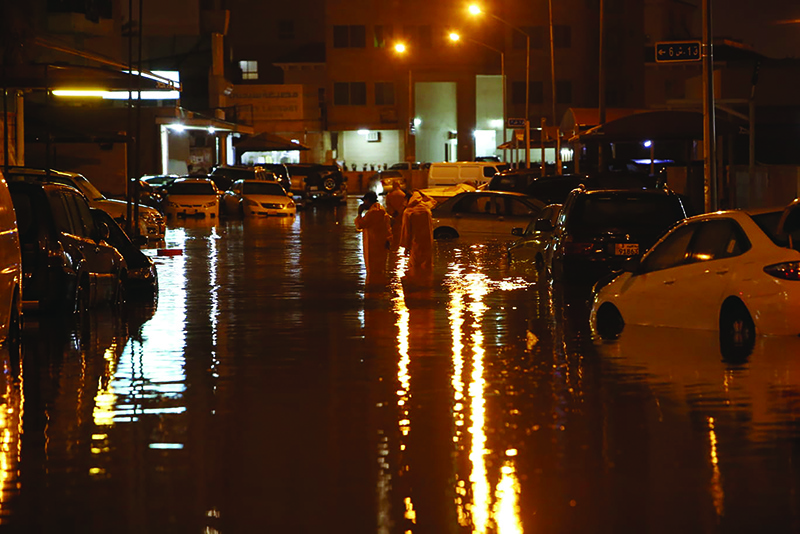 KUWAIT: A waterlogged street is seen in Fintas after heavy rainfall yesterday. — Photo by Yasser Al-Zayyat