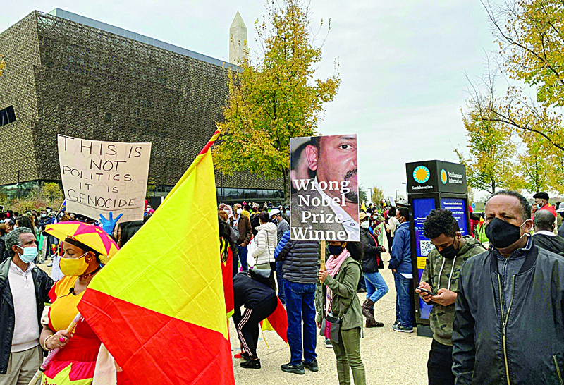 Ethiopians from Tigray region gather near the National Museum of African American History and Culture, in Washington DC, asking to stop the actual military conflict in Ethiopiaís Tigray region between regional forces and the Ethiopian federal army on November 21, 2020. - Ethiopia's northern Tigray region has been rocked by bloody fighting since November 4, when Ethiopian Prime Minister Abiy Ahmed announced the launch of military operations there. Neighbouring Sudan, itself suffering from a severe economic crisis, was caught off-guard when the conflict broke out earlier this month. It now hosts some 36,000 Ethiopians, with many in transit camps near the border, according to Sudan's refugee commission. (Photo by Daniel SLIM / AFP)