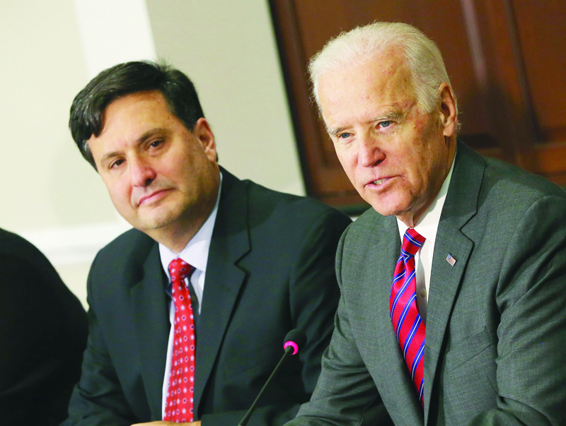 (FILES) In this file photo taken on November 13, 2014 US Vice President Joseph Biden (R) joined by Ebola Response Coordinator Ron Klain (L), speaks during a meeting regarding Ebola at the Eisenhower Executive office building in Washington, D.C. - President-elect Joe Biden's campaign confirmed today, November 11, Ronald Klain will be the White House chief of staff. (Photo by MARK WILSON / GETTY IMAGES NORTH AMERICA / AFP)